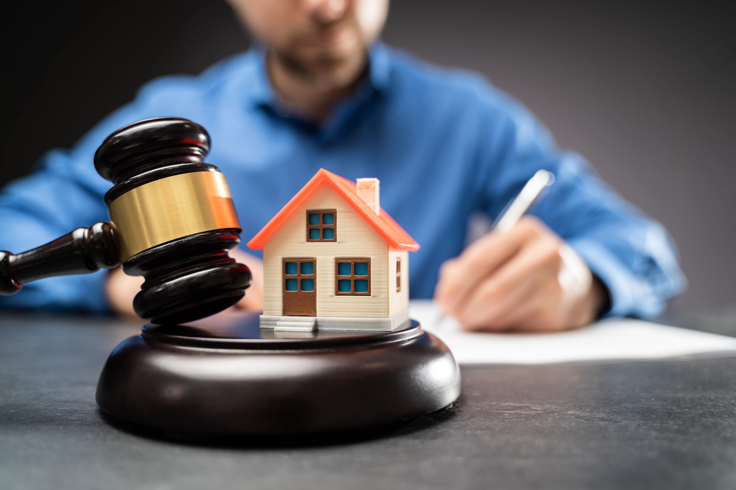 A real estate attorney is working with clients to help them buy or sell a house.